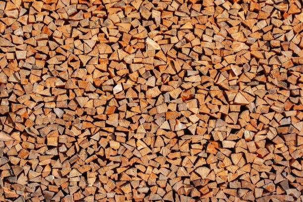 Large firewood wood pile made up of many small, neatly stacked pieces of wood.