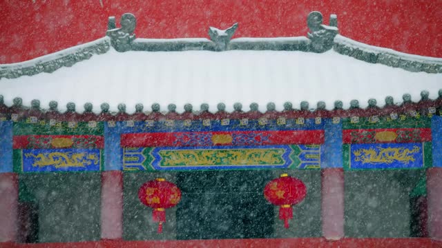 Snow  falling on China eaves and ancient buildings in winter
