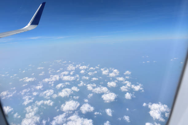 istock View of clouds from airplane window. 2042218145