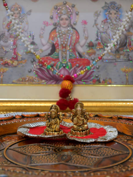 istock Small statue of Lord Ganesh and Goddess Laxmi. 2042236582