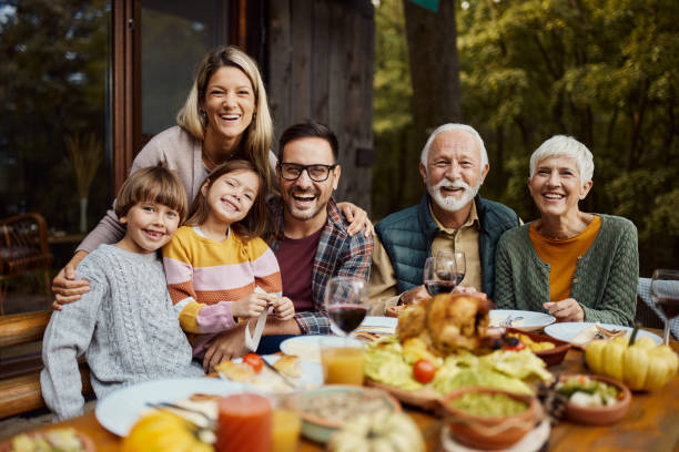 istock Happy multi-generation family enjoying in lunch on a patio. 2042243337