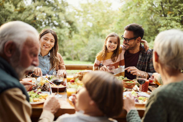 istock Happy multi-generation family enjoying in lunch on a terrace. 2042243857