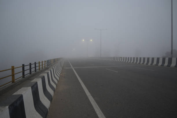 istock Fog on the road in early morning. 2042253907
