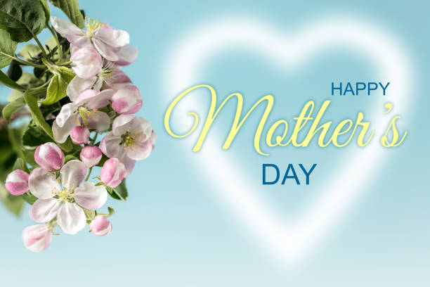 Glowing heart shape with HAPPY MOTHER'S DAY lettering and apple blossom. Can be used as a design for Mother's day holiday greeting cards or posters.