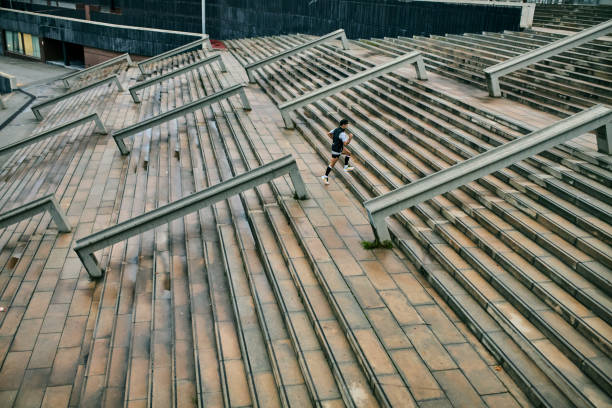 istock Dedicated urban athlete training on outdoor steps 2042262563