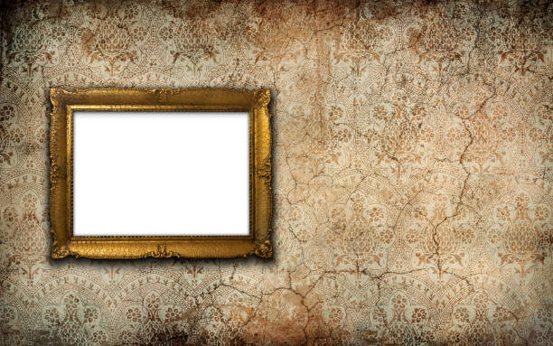 istock Golden vintage picture frame with blank space on an old wall 2042264627