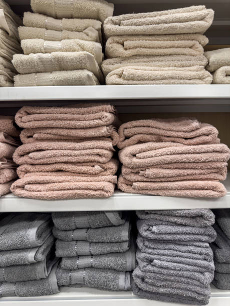 istock Stack of terry towels in different colors on shelf in store 2042286530