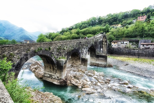 A scenic view of Ponte del Diavolo Bridge in Tuscany