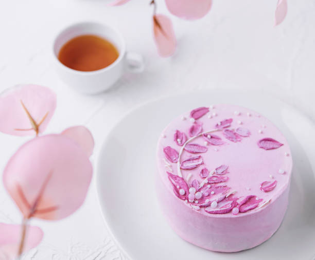 istock Piece of chocolate cake with pink cream and tea 2042306921
