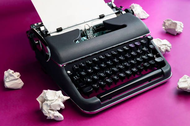 istock Vintage typewriter and crumpled paper sheets. Writer and blogger concept 2042317437