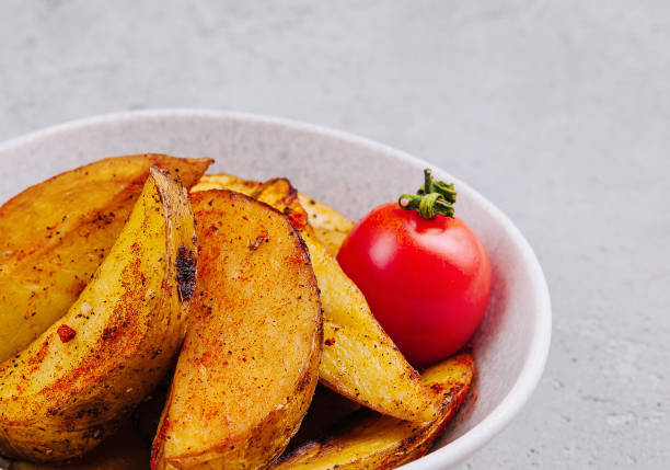istock Roasted potato wedges with spices 2042353824