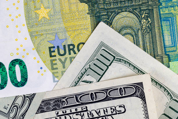 various freely convertible currencies euros and dollars stacked in a pile - european union euro note currency forex european union currency стоковые фото и изображения
