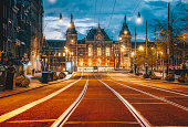 Amsterdam Central Train Station at Night in Foggy Dusk