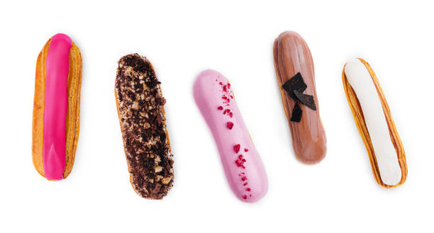 istock different types of French eclairs on a white plate isolated on white background 2042375185