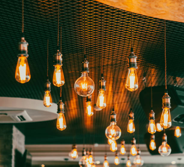 istock Decorative antique edison style filament light bulbs hanging from ceiling 2042400516