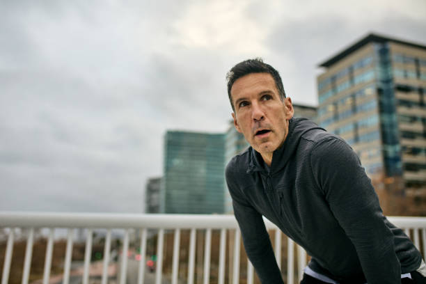 Focused male athlete preparing for afternoon run