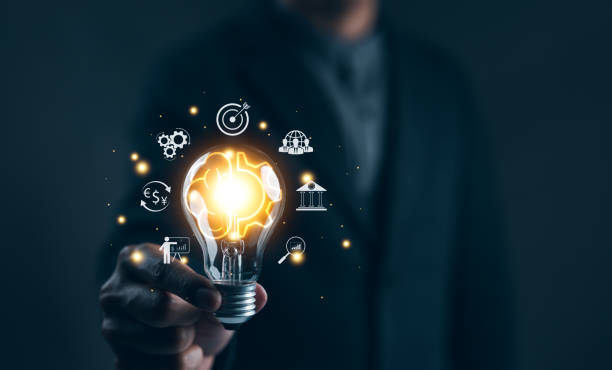 istock Idea solution business strategy concept. Businessman hand holding light bulb with business icons. Digital marketing, Financial and banking, Internet connection application technology, Business goals, 2042428198