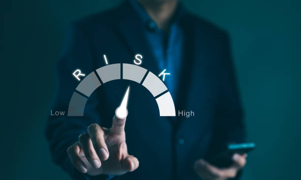 istock Risk management concept. Businessman touching risk level indicator virtual rating low to high for financial banking analysis and business. money risk assessment, Reducing project risk, invest strategy 2042428208
