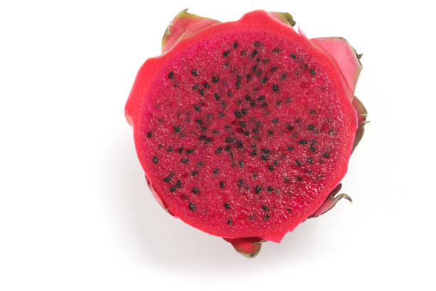 istock Half cut fresh organic red dragon fruit delicious fruit top view isolated on white background clipping path 2042449474