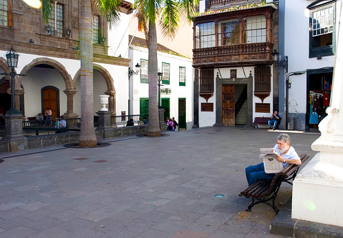 Santa Cruz de la Palma, La Palma, Canary Islands, Spain, February 2008, Plaza de Espana with a man reading newspaper