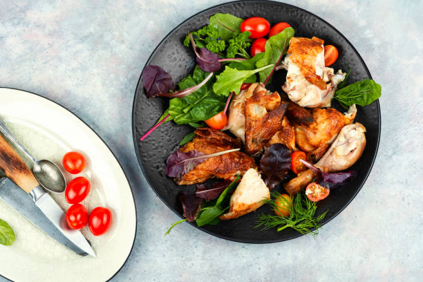 istock Mix of baked chicken pieces. 2042471719
