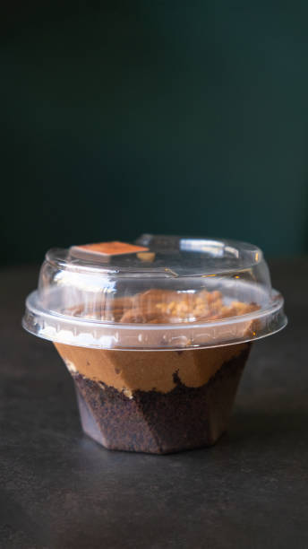 istock Chocolate dessert with cream and biscuit in a plastic cup. 2042474910