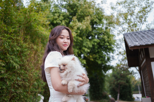 woman holding puppy