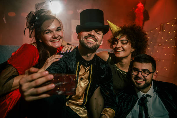 istock Friends having fun and taking selfies when hanging out during a Halloween party 2042506954