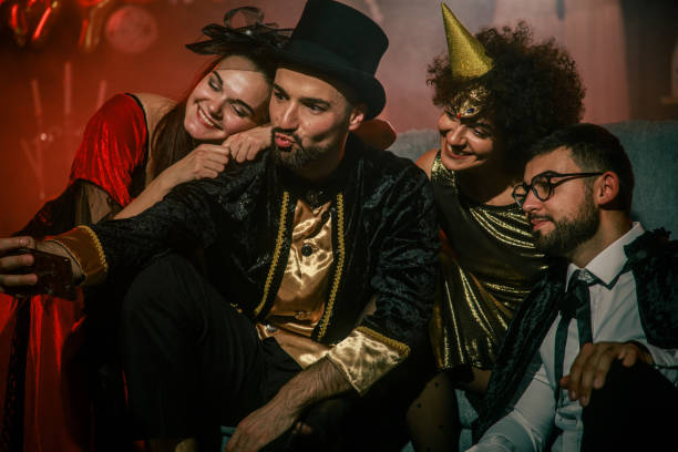 istock Friends having fun and taking selfies when hanging out during a Halloween party 2042506965