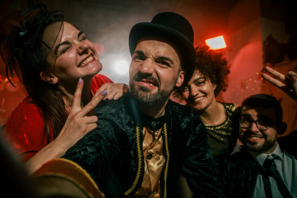 istock Friends having fun and taking selfies when hanging out during a Halloween party 2042506978