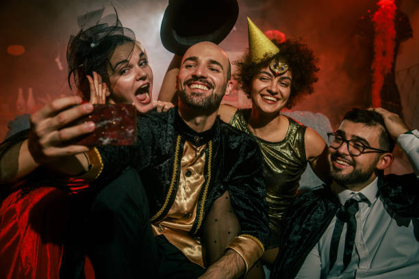 istock Friends having fun and taking selfies when hanging out during a Halloween party 2042506989