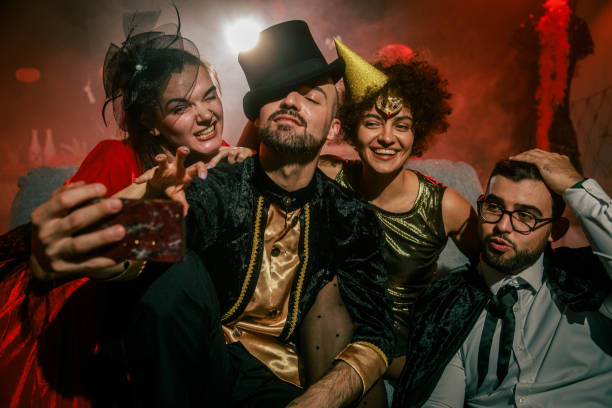 istock Friends having fun and taking selfies when hanging out during a Halloween party 2042525214