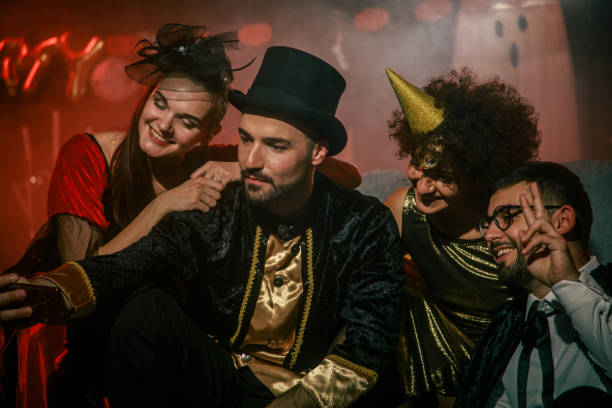 istock Friends having fun and taking selfies when hanging out during a Halloween party 2042525217
