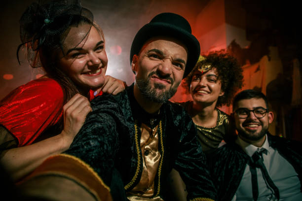 istock Friends having fun and taking selfies when hanging out during a Halloween party 2042526833