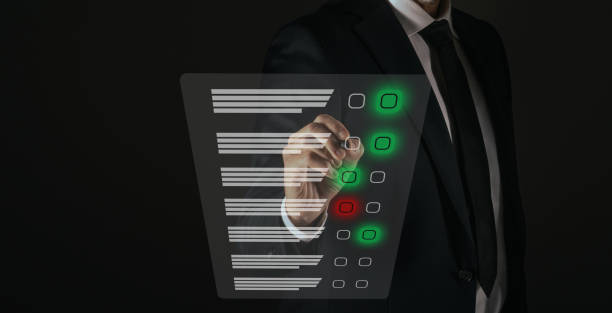 istock Man do online exam on virtual screen. Answer a survey filling out a tech form. Quiz, test concept 2042532827