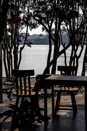 The silhouette of a dinette set by the lake