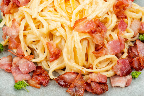 istock Homemade pasta with fried bacon. 2042557019