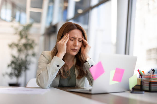 istock Female employee having health problems at workplace 2042558074