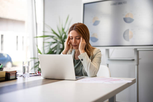istock Female employee having health problems at workplace 2042558587