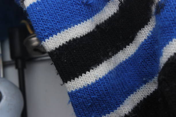The surface of these blue white black and thick knitted gloves is handmade, the material is soft and warm.