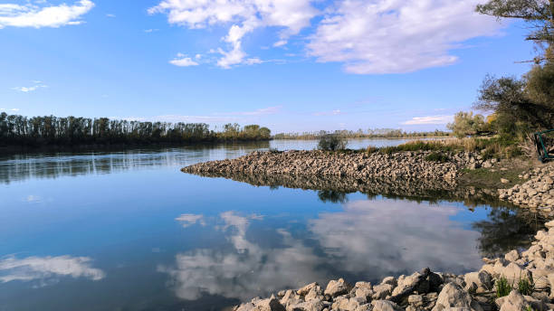 istock blue sky and white clouds reflected in Danube river in Vojvodina 2042589383