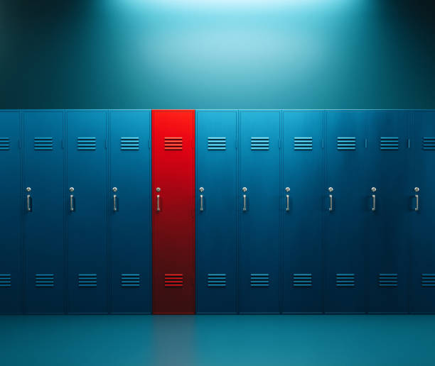 Locker room full of blue lockers, but one stands out and it is red. Concept of being different, individuality and making the right choice.