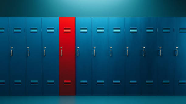 Locker room full of blue lockers, but one stands out and it is red. Concept of being different, individuality and making the right choice.