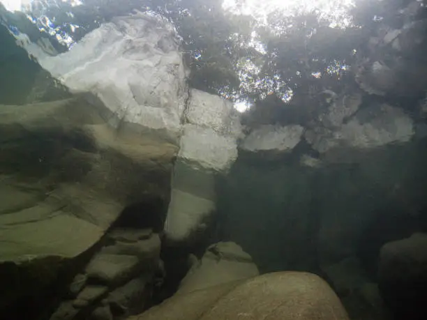 Scuba diving crystal clear waters of Verzasca River