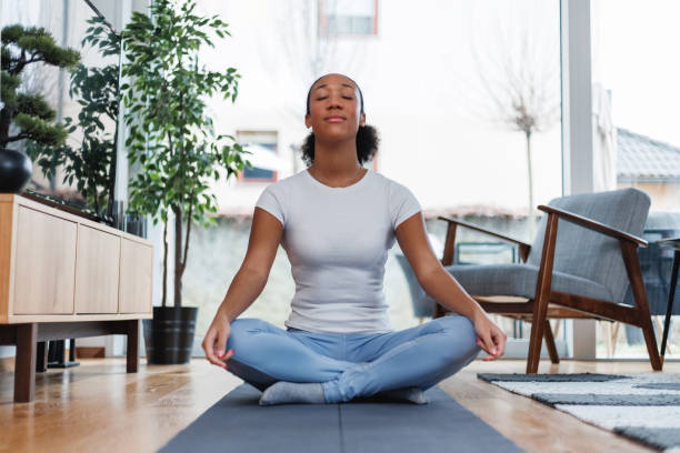 istock Young Woman Practicing Yoga Indoors 2042654389