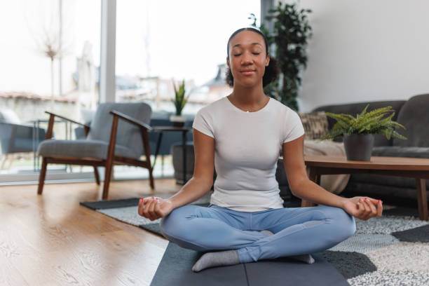 istock Woman Practicing Yoga at Home 2042654557