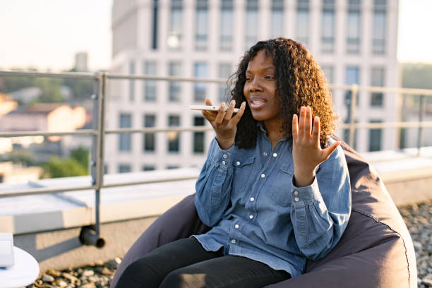istock African freelancer discussing new project while staying on office roof terrace. 2042671824