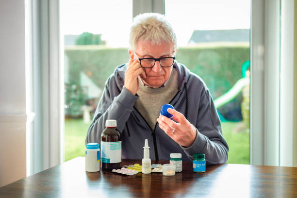 istock Senior man looking at his medication 2042674516