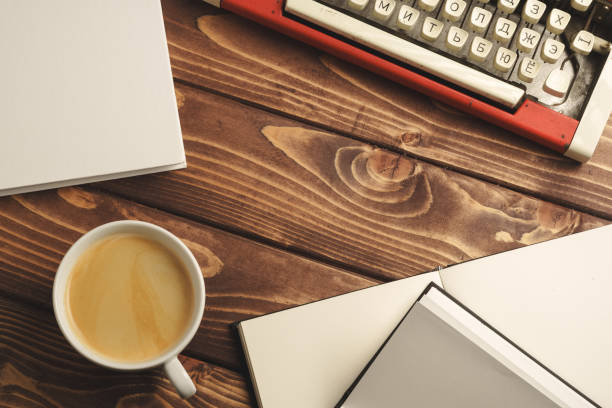 istock Vintage typewriter on wooden table close up 2042684836