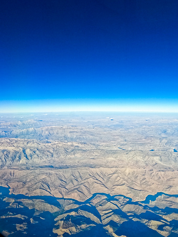 View from the airplane window mid air, above Iran.